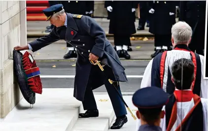  ??  ?? Dutiful son: The Prince of Wales, who has gradually been taking on more of his 91-year-old mother’s engagement­s at her behest, places a wreath of poppies at the Cenotaph yesterday