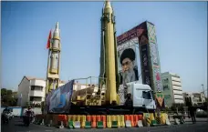  ?? Picture: REUTERS ?? VILIFIED: A display featuring missiles and a portrait of Iran’s Supreme Leader Ayatollah Ali Khamenei at Baharestan Square in Tehran.