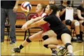  ?? KIRK NEIDERMYER — FOR DIGITAL FIRST MEDIA ?? Archbishop Carroll’s Gina Custer, left, here out-reaching teammate Amelia Painter for a dig in the PIAA Class 4A quarterfin­als against Bishop Shanahan, dug out 229 shots this year for the Patriots.