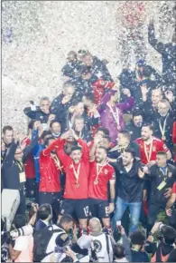  ?? (AFP) ?? Al Ahly players celebrate winning the CAF Champions League Final against Zamalek at the Cairo Internatio­nal Stadium, Egypt. on Friday.