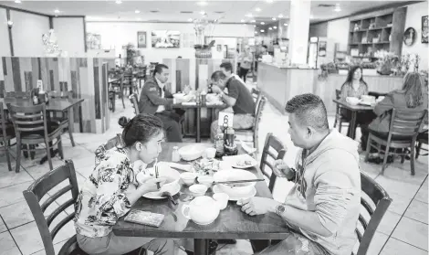  ?? Photos by Melissa Phillip / Staff photograph­er ?? Asiatown’s Pho Ga Dong Nai welcomes pho experts and newbies alike.