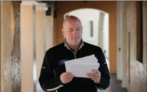  ?? (AP/John Raoux) ?? Leon Hayner, an associate dean of students at Rollins College in Winter Park, Fla., looks at requests from the U.S. Census Bureau last week.