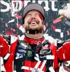  ??  ?? Kurt Busch celebrates after winning the NASCAR race Sunday in Richmond, Va.