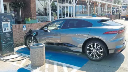  ??  ?? It took about an hour and a half to charge the Jaguar I-Pace to full at the Harrismith DC charging station.