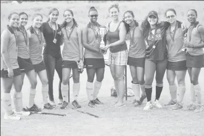  ??  ?? Bingo Spartans receive their championsh­ip trophy after capturing the GHB girls Under - 19 title.