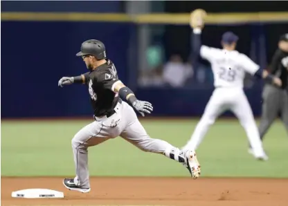  ?? | AP ?? The Sox’ Yolmer Sanchez sprints around second base before his hit leading off the game was ruled a home run Tuesday.