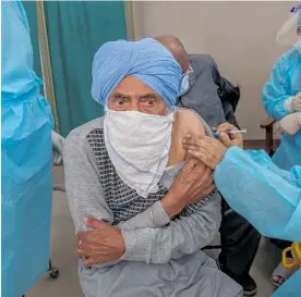  ?? Photo / AP ?? A Kashmiri man receives a vaccine for Covid-19 at a primary health centre in Srinagar, Indian controlled Kashmir.