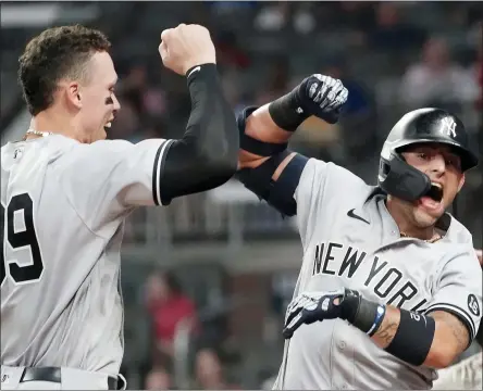  ?? JOHN BAZEMORE — THE ASSOCIATED PRESS ?? New York Yankees second baseman Rougned Odor (12) celebrates with Aaron Judge (99) after hitting a solo home run in the seventh inning of a baseball game against the Atlanta Braves Tuesday, Aug. 24, 2021, in Atlanta.