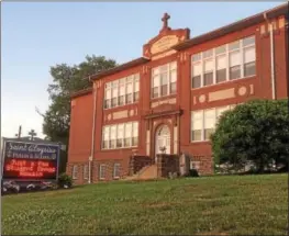  ?? EVAN BRANDT — DIGITAL FIRST MEDIA ?? The cornerston­e of the St. Aloysius Parish School building on North Hanover Street was laid in 1913. The school will be moving into the former St. Pius X High School on North Keim Street at the start of the 2017-18 school year.