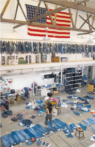  ?? Liz Hafalia / The Chronicle ?? An assortment of clothes is laid out and hangs at Levi’s innovation lab in San Francisco. The apparel maker is attempting to strengthen its e-commerce presence with a new service it is calling Virtual Stylist.