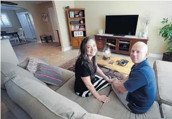  ?? JIM RASSOL/STAFF PHOTOGRAPH­ER ?? Rachel Bryan and her boyfriend, Nicholas Freeman, struggled to find a home before closing on one in Boca Raton. Analysts and real estate agents say desirable homes remain in short supply, despite higher prices.