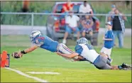  ?? THE OKLAHOMAN] ?? Southwest Covenant's Ben Webb leaps to the end zone past Coyle's Brendon Weathers last season. SW Covenant is looking to have another deep playoff run. [BRYAN TERRY,