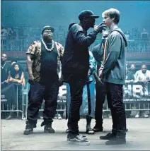  ?? Neon ?? RAPPERS Behn Grymm (Long, left front) faces Adam (Worthy) in “Bodied,” which opens Wednesday on YouTube Premium.