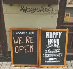  ?? COLM FULTON / REUTERS ?? A sign outside a pub in Stockholm assures people that the bar is open during the coronaviru­s outbreak. Sweden has few restrictio­ns, although it has 3,046 cases.