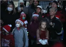  ?? ?? FESTIVE: People watch during the USS Constituti­on tree lighting ceremony.