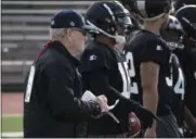  ?? ALLIANCE OF AMERICAN FOOTBALL VIA AP ?? In this Jan. 20, 2019, photo released by the Alliance of American Football, Bill Polian, Alliance of American Football head of football and co-founder, left, watches as players with the Birmingham Iron practice in San Antonio.