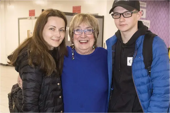  ?? ?? Dream companions: Jenni meets Zoryana, left, and Ustym at Luton Airport after their emotional journey from Lviv via Warsaw