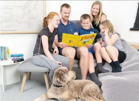  ?? DEVIN MANKY ?? Daniel Sedin of the Vancouver Canucks and his wife Marinette Sedin, a literacy teacher with the Canucks Family Education Centre, read with their children Ronja, Erik and Anna, left to right. “I’ll have three or four books on the go at one time,”...