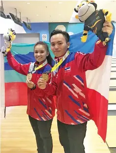  ??  ?? GOLD WINNERS: Nevern (right) and Nurul Alyssa delivered Sabah’s first two gold medals in the 19th Sukma in Perak.