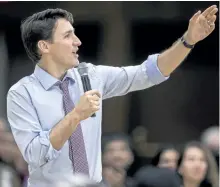  ?? GEOFF ROBINS/THE CANADIAN PRESS ?? Prime Minister Justin Trudeau speaks at a town hall event at Western University in London, Ont., last week. Trudeau launched a revamped youth service program this morning pledging $105 million over the next three years to help Canadian youth volunteer...