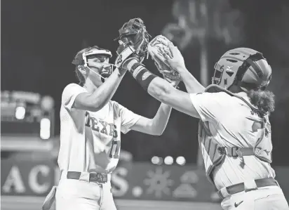  ?? PROVIDED BY TEXAS ATHLETICS DEPARTMENT ?? Texas pitcher Teagan Kavan, left, celebrates with catcher Reese Atwood during the Longhorns’ 9-2 win over Stanford on Feb. 16 in a Clearwater, Fla., tournament. Kavan, a freshman, has become the Longhorns’ top pitcher and leads the team in innings pitched, wins, appearance­s, starts and complete games.