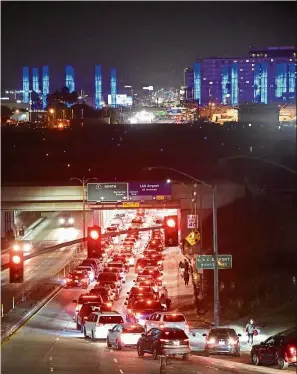  ??  ?? Traffic snarl: Cars slowing to a crawl near LAX as part of the airport was closed briefly due to a security scare. — Reuters