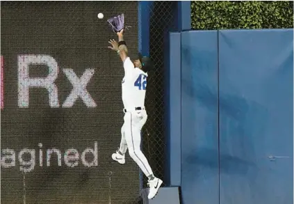  ?? LYNNE SLADKY/AP ?? Marlins center fielder Jazz Chisholm Jr. can’t get to a ball hit by the Diamondbac­ks’ Lourdes Gurriel Jr. for a double during the first inning Saturday in Miami.