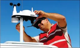  ?? LOANED PHOTO ?? MICHAEL FILA, COCOPAH EMERGENCY manager, works on the Cocopah Tribe’s weather-ready station.