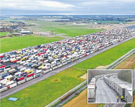  ??  ?? Lorries cram the runway at the former Manston Airport and, inset, line the M20