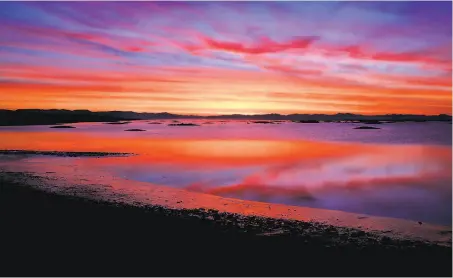  ?? Photos by Michael Macor / The Chronicle 2016 ?? The sun rises over the Sears Point wetlands restoratio­n site on the edge of San Pablo Bay, part of renewing Bay Area wetlands.