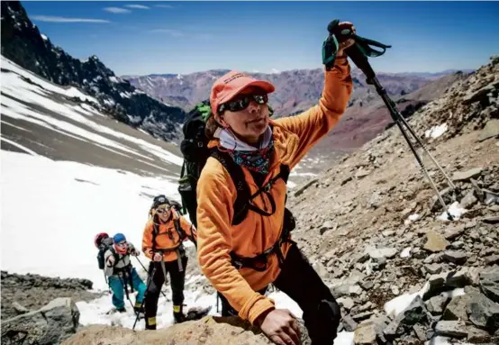  ?? MAX WHITTAKER/NEW YORK TIMES ?? Above, Ms. de la Houssaye made her way toward Camp One during the ascent of Aconcagua, the highest summit outside the Himalayas, in Aconcagua Provincial Park, Argentina, in January 2019. Left, she and her daughter Bella took a break, just a few hours shy of the summit. Below, Ms. de la Houssaye during a swim.