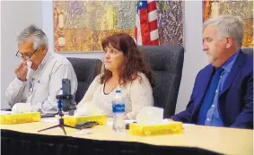  ??  ?? APS Police Chief Steve Gallegos, left, chokes up while discussing APS police officer Martin Martinez, who died in a balloon crash Saturday along with four others. At center is Kristine Meurer, executive director of the APS student, family and community supports division, and Scott Elder, APS superinten­dent, right.