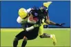  ?? RICK SCUTERI — THE ASSOCIATED PRESS ?? Iowa State wide receiver Tarique Milton (1) is hit by Oregon safety Jamal Hill during the second half of the Fiesta Bowl on Saturday in Glendale, Ariz.