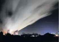  ?? PHOTO: REUTERS ?? Heat and carbon . . . Smoke and steam billow from Belchatow Power Station, Europe’s largest coalfired power plant operated by PGE Group, at night near Belchatow, Poland, earlier this week.