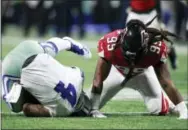  ?? JEFF HAYNES — AP IMAGES FOR PANINI ?? Falcons defensive end Adrian Clayborn (99) sacks Dallas Cowboys quarterbac­k Dak Prescott (4) during Sunday’s game in Atlanta.