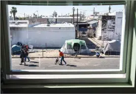  ?? ?? The homeless encampment, seen from the window of a nearby building