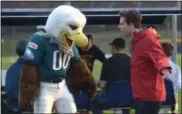  ?? PETE BANNAN - DIGITAL FIRST MEDIA ?? Swoop performs the Fly Eagles Fly dance with Trey Gillece during the Student vs. Faculty charity flag football game on Monday.