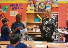  ??  ?? Perdue says the school is a place for students to escape whatever challenges they face at home. “We’re a family and we’re safe,” she tells them.