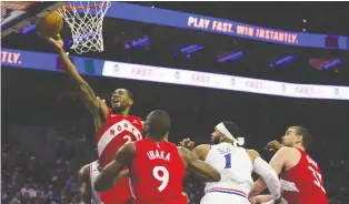  ?? MITCHELL LEFF/GETTY IMAGES ?? Kawhi Leonard of the Raptors goes up to score two of his 39 points in Sunday’s Game 4 win over the 76ers in Philadelph­ia. Leonard also pulled in 14 rebounds.