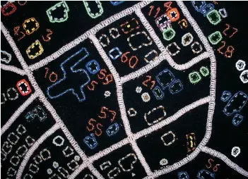  ??  ?? Lizzie Ittinuar (b. 1930 Kangiqlini­q) — Map of Hamlet of Rankin Inlet, Nunavut 2005 Wool and beads 152 × 198 cm COLLECTION CANADA COUNCIL ART BANK