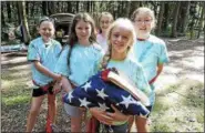  ??  ?? Cadette Girl Scouts serving as the Color Guard at Opening Flag.