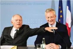  ??  ?? BERLIN: German Finance Minister Wolfgang Schaeuble (left) and the new French Economy Minister Bruno Le Maire prepare to give a press conference yesterday in Berlin. — AFP