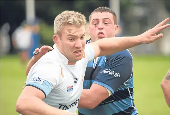  ?? Picture: Jon Mussen. ?? Danny Levison on his way to bagging Dundee’s fifth and final try – a terrific solo effort that saw him swat off four tacklers.