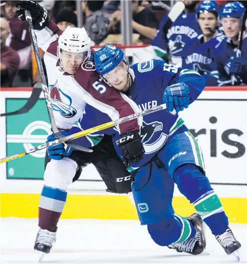  ?? — THE CANADIAN PRESS FILES ?? The Canucks’ Alex Biega, right, ‘has worked on his game a lot and is a great example for young guys,’ says coach Travis Green. ‘ … He’s strong and works on his shot all the time.’