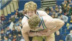  ?? GARRETT/MORNING CALL FILE DAVID ?? Faith Christian’s Adam Waters, top, scored four bonus wins this past week, including a technical fall against Berks Catholic thanks to four takedowns in last 47 seconds.