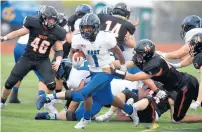  ?? STEVE JOHNSTON/DAILY SOUTHTOWN ?? Cronk, right, tackles Lincoln-Way East’s Jamal Johnson.