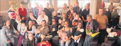  ??  ?? BIG FEED: Most of the mums, babies and friends with host Anna Clark at The Vault Cafe´ on Friday’s Big Latch On.