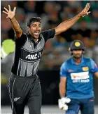  ?? PHOTOSPORT/AP ?? Ish Sodhi, left, and Mitchell Santner worked in tandem for New Zealand in their Twenty20 win over Sri Lanka.