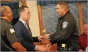  ??  ?? Madison County Deputy Jonathan Morticelli accepts the Karl Taylor Stop DWI award from Madison County District Attorney Bill Gabor and Madison County Sheriff Allen Riley.