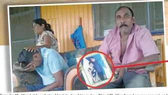  ?? Photos: Arieta Vakasukawa­qa ?? Damodar Mudiliar holds a photo of his late daughter-in-law, Shinal Mudiliar from her engagement, as his son, Sandeep Mudiliar, (Shinal’s husband) wept silently while being comforted by his mother, Amra Wati at their home in Uciwai Field 40 in Nadi on April 1, 2018. Shinal Mudiliar and her father Veer Gounder were killed after the car they were travelling in was swept away by strong currents while attempting to cross the flooded Tubarua Bridge in Nadi. Top photo: Police officers and helpers at Uciwai, Nadi on April 1 2018 taking a break after working to retrieve the car which Shinal Mudiliar and her father were travelling in.